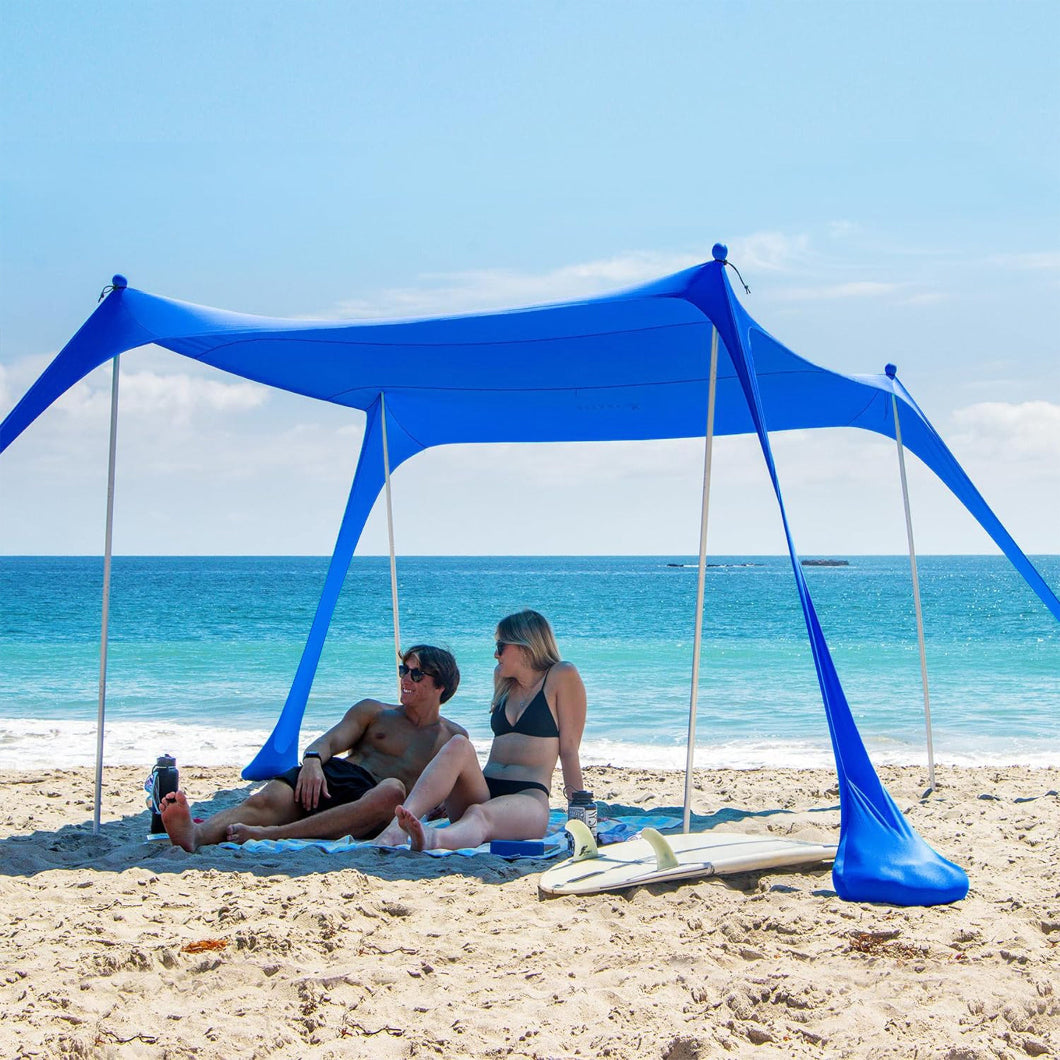 Two people lying under AMMSUN 9x9ft Portable Lycra Beach Tent,Blue - AMMSUN Beach Umbrella