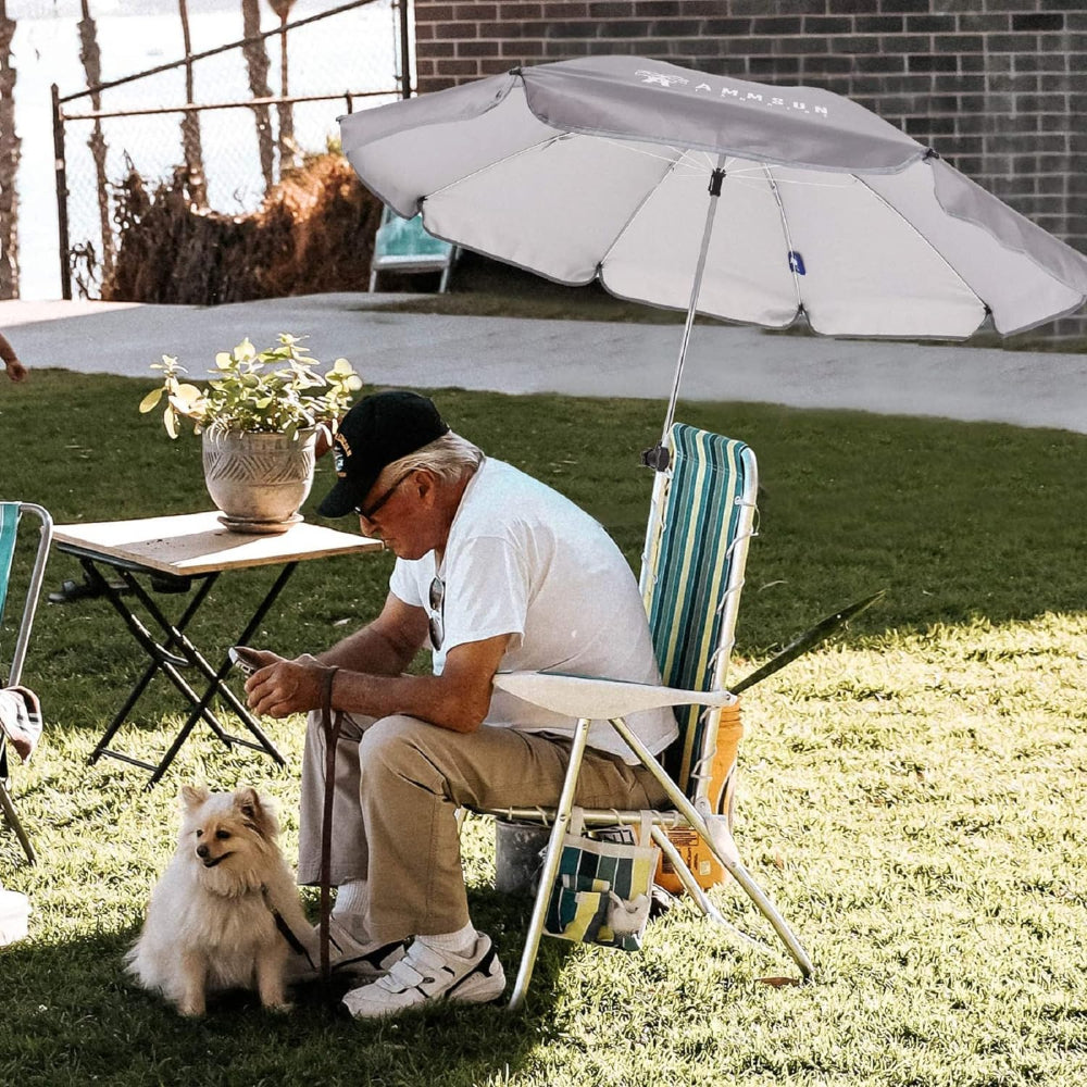 A man sitting under AMMSUN grey 43 inches outside umbrella chair Umbrella with universal clamp on the patio chair