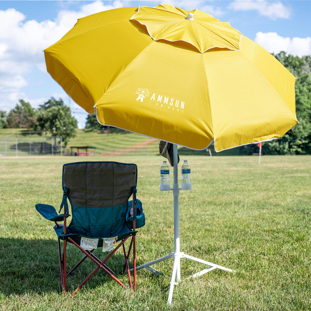 A chair under AMMSUN 6.5ft yellow portable sports umbrella for sun shades with stand for travel beach umbrella