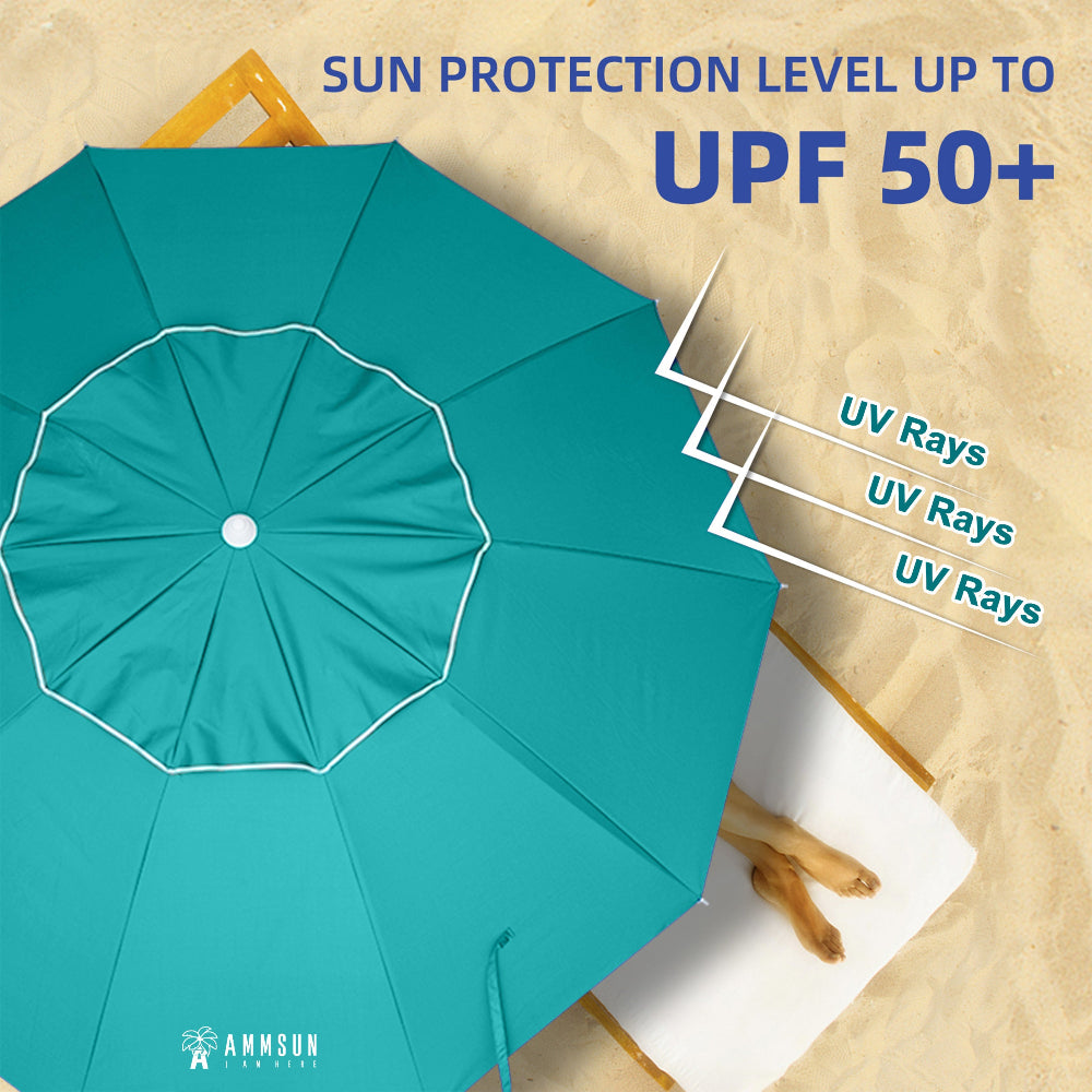 A woman lying under AMMSUN teal 8ft sun protection umbrella for beach UPF50+ wth sand anchor