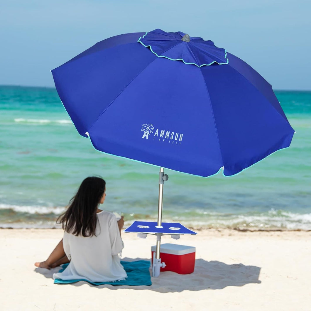 A woman is having fun under AMMSUN blue 7ft wind resistant beach umbrella with sand anchor and table tray