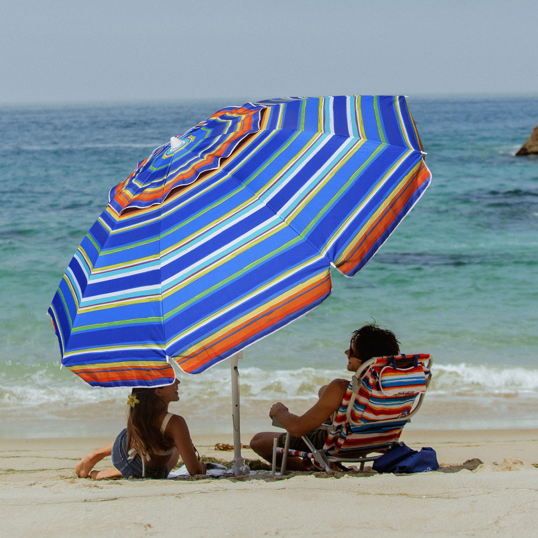 A couple under AMMSUN 8ft Red Blue Stripes sombrilla de playa with beach umbrella sand anchor