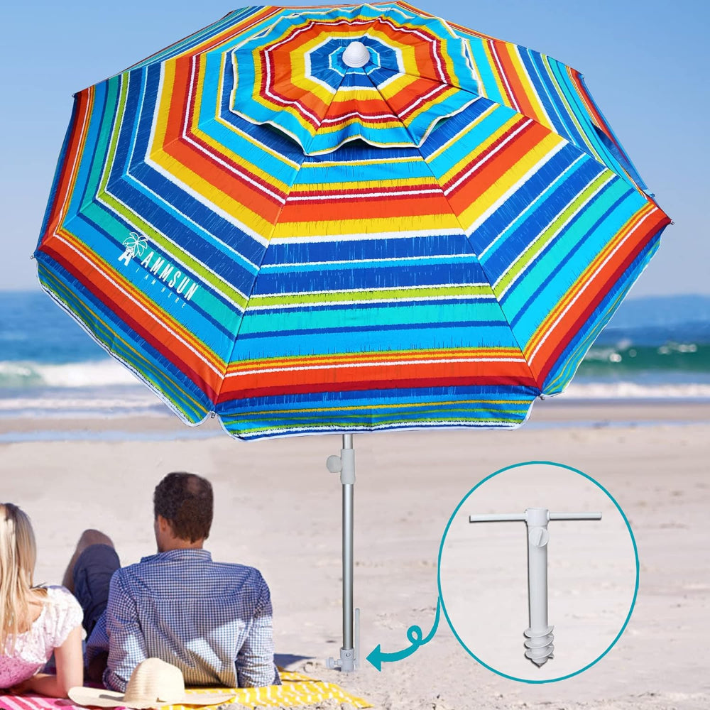 A couple enjoying the shade of an AMMSUN 6.5ft red stripes patio table umbrella for beach with sand anchor