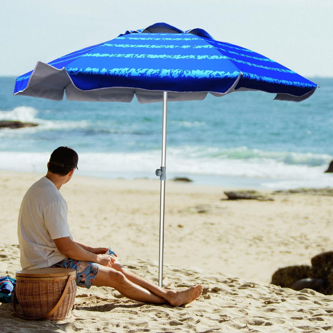 A wan is sitting AMMSUN 7ft blue pattern beach umbrellas for sand with sand anchor on the beach