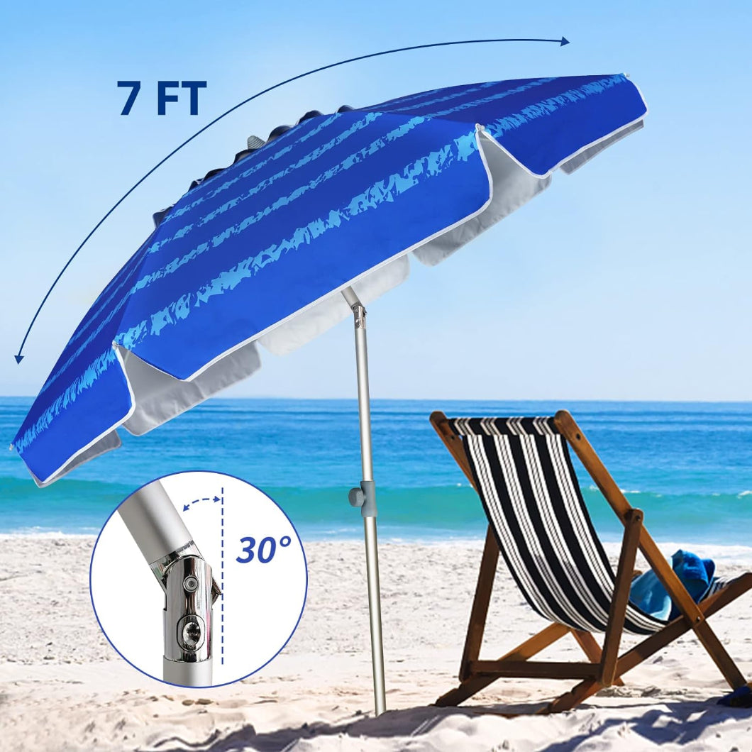 A beach chair is under and AMMSUN 7ft blue pattern beach chair umbrella with sand anchor tilted at 30°