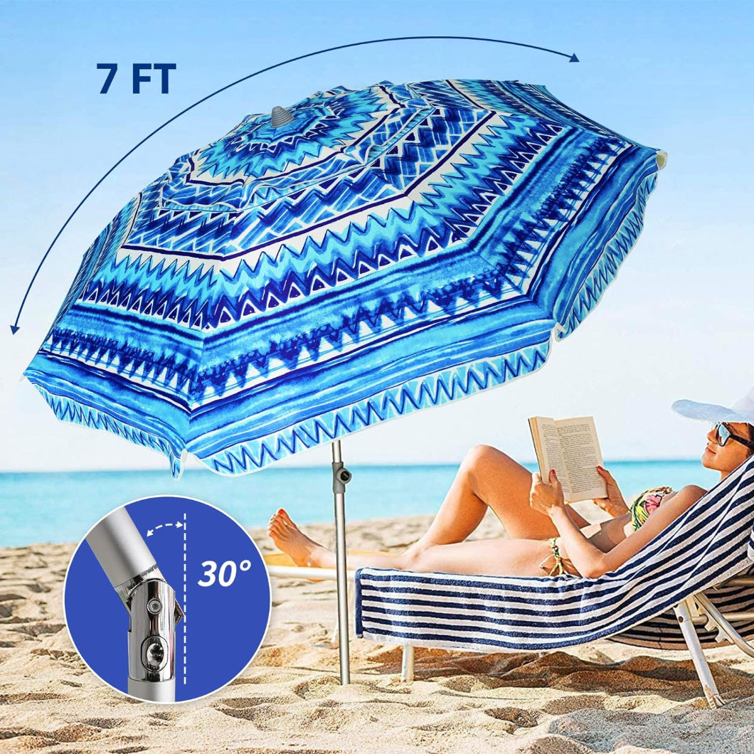 A woman is lying on a beach chair under AMMSUN 7ft multicolor blue beach umbrella with stand tilted at 30°