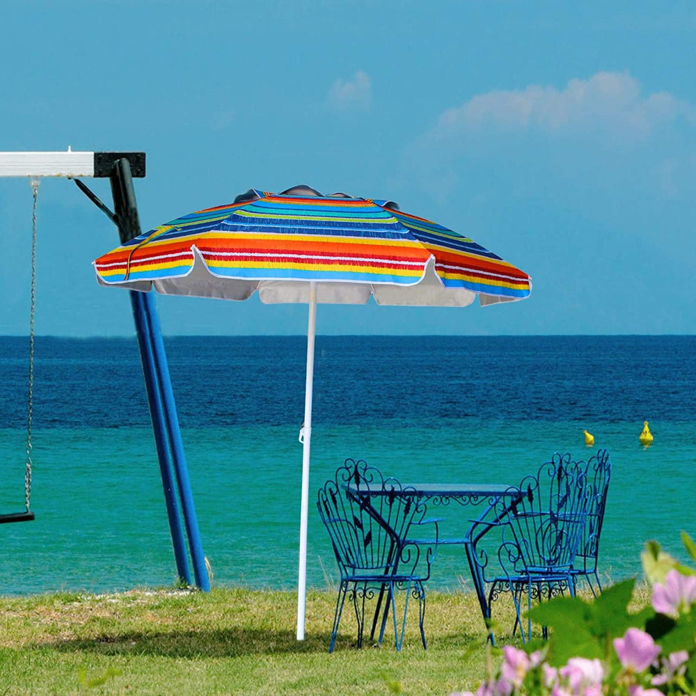 A swing set beside a table with an AMMSUN 6.5FT orange stripes garden umbrellas outdoor beach umbrella