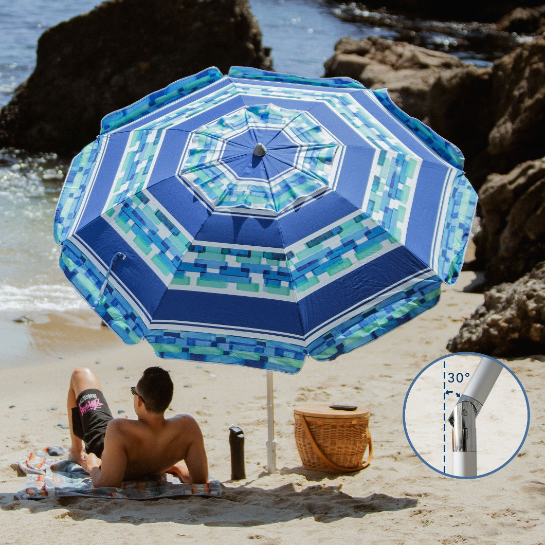 A man is lying on a beach chair under AMMSUN 7ft ice blue stripe umbrella beach with sand anchor tilted at 30°