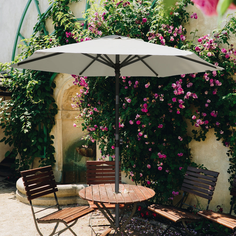 A patio table with chairs is set beneath AMMSUN 6FT white outdoor patio umbrella for outdoor table umbrella