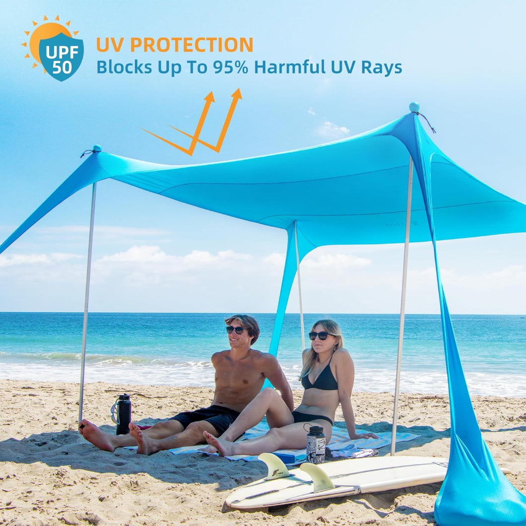 A pair of people relaxing under AMMSUN beach umbrellas for sand heavy duty wind portable