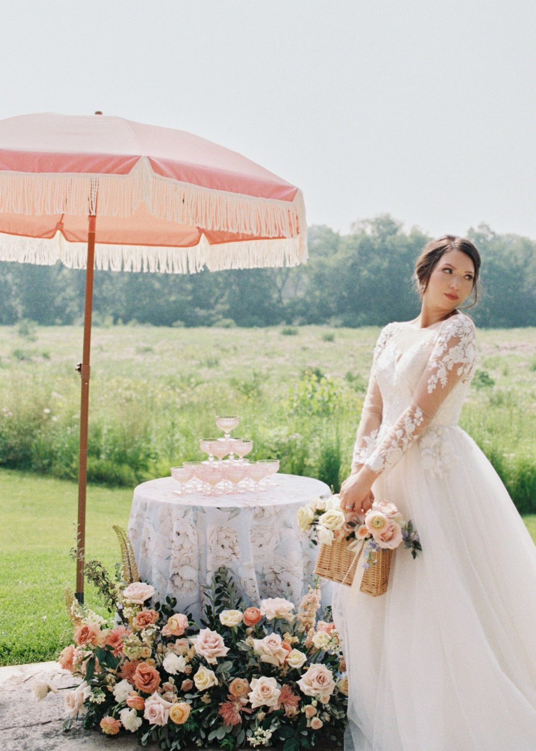  A bride wearing a beautiful wedding dress stands beneath AMMSUN 7ft pink beach umbrella for outdoor umbrella