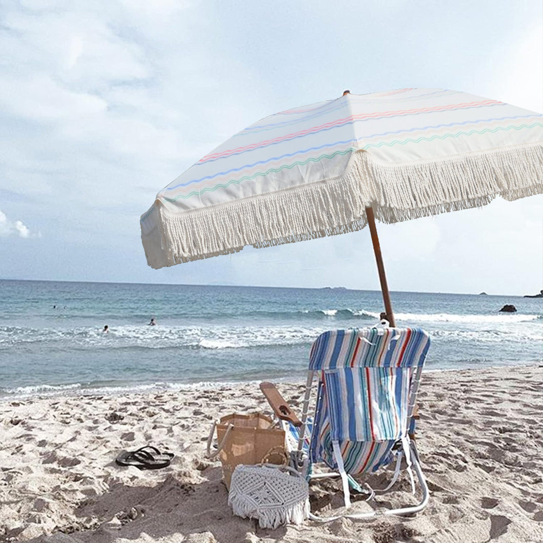 A beach chair and AMMSUN 7ft seafoam fringe outdoor umbrellas for patio and beach vintage umbrella