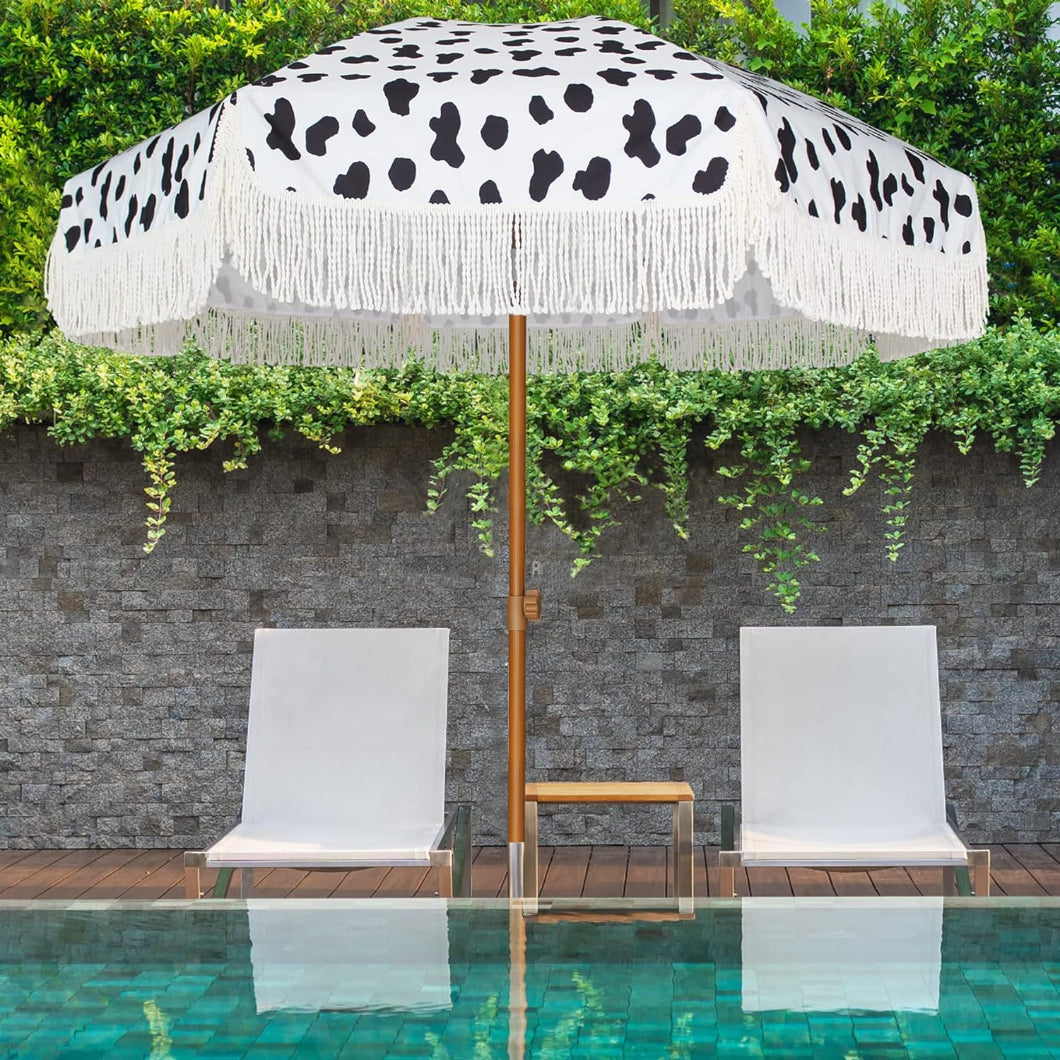  A serene pool scene featuring an AMMSUN 7ft Cow Polka Dots fringe standing umbrellas and two chairs