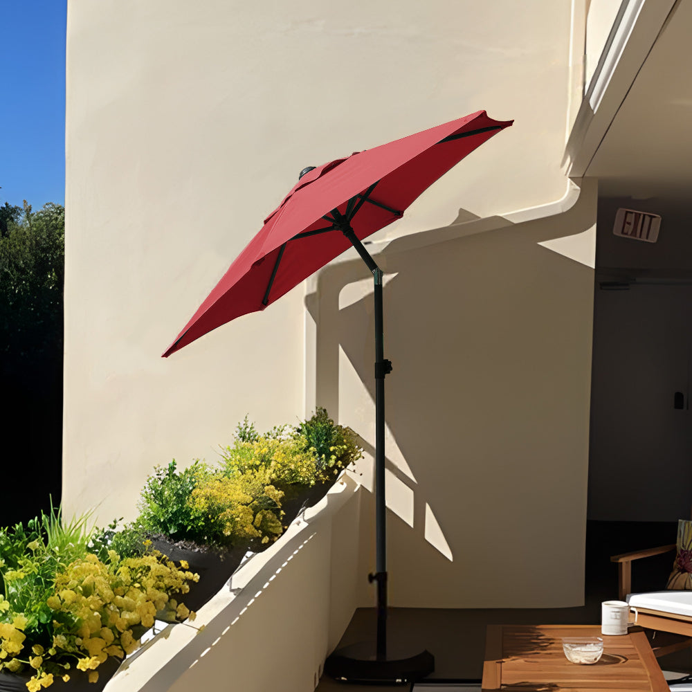 AMMSUN 6ft red patio table umbrella with base for parasol umbrella included tilted at 30° is placed on the balcony