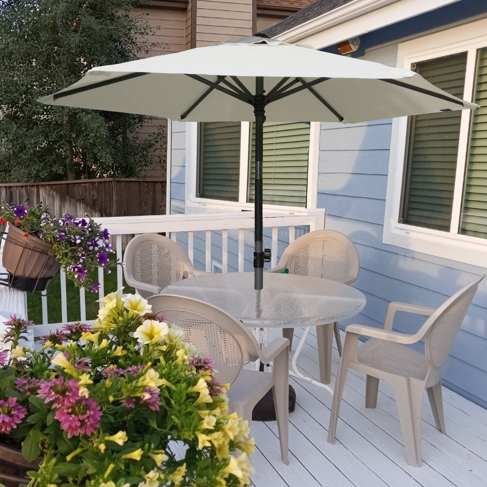 A cozy patio setup featuring a table, several chairs, and a large AMMSUN 6ft white sunbrella outdoor umbrella