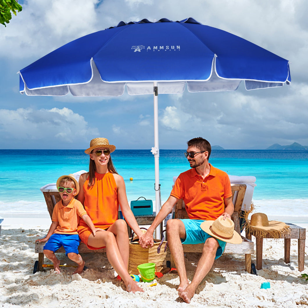 A couple and their child sit on the beach beneath AMMSUN blue 8ft lrge size umbrella for patio with sand anchor