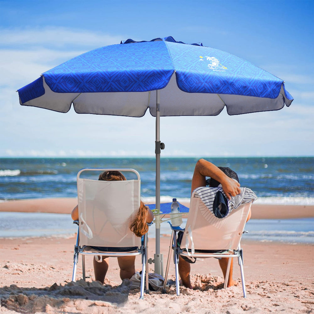 Two people relaxing in chairs shaded by AMMSUN 6.5ft blue outdoor umbrella with sand anchor & table tray