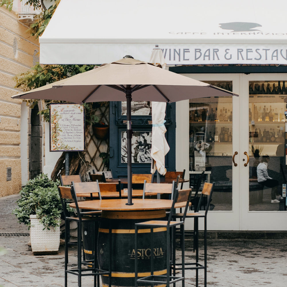 A charming wine bar featuring an outdoor table with AMMSUN 6ft beige  umbrellas for patio picnic table