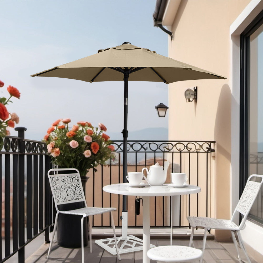 A porch featuring white chairs arranged under an AMMSUN 6ft tan outdoor umbrellas for balcony umbrella