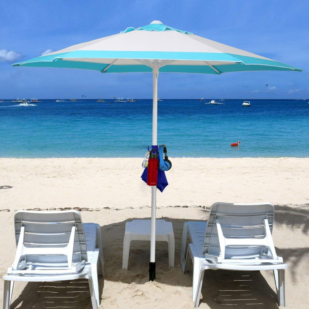 Two beach chairs positioned under a large umbrella with AMMSUN blue plastic hanging hook with a water bottle, towel and headphones on it