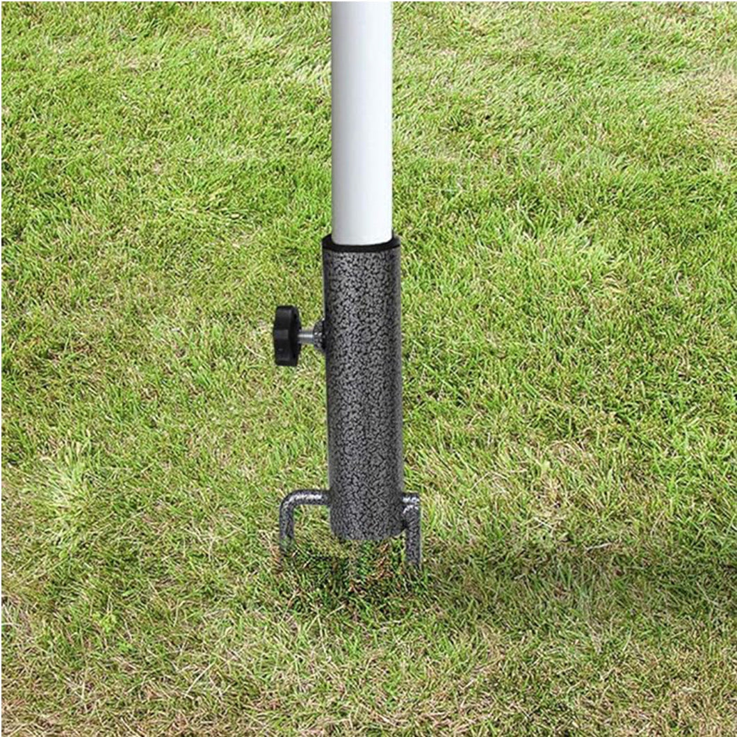 A white pole topped with AMMSUN black steel beach umbrella stand for sports umbrella holder placed on grass.