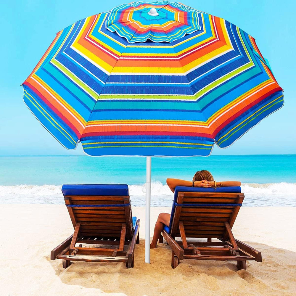 A woman relaxes in a chair beneath an AMMSUN 6.5ft orange stripes portable sun shade umbrella high wind umbrella