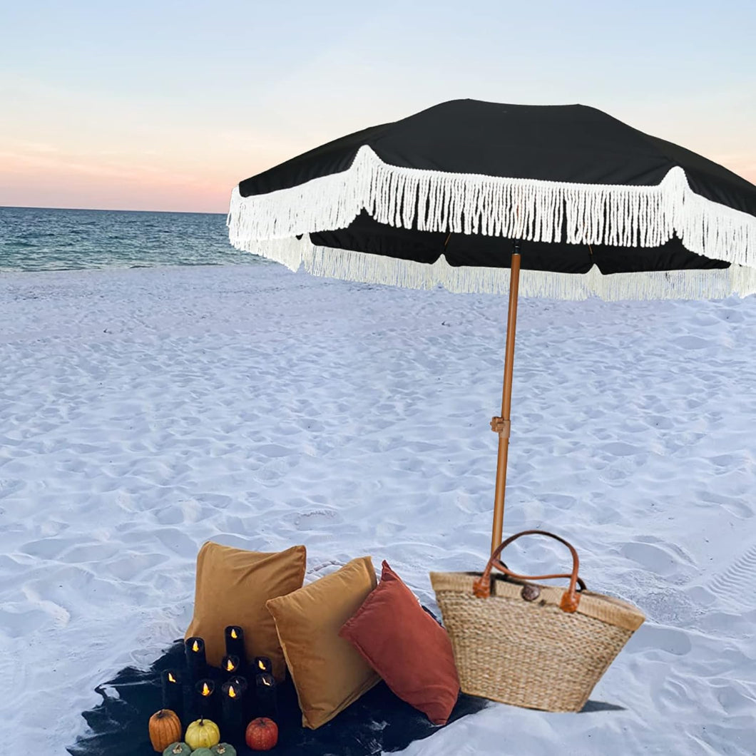 AMMSUN 7ft Noble Black fringe sombrilla for beach unbrella and a basket resting on the sandy shore