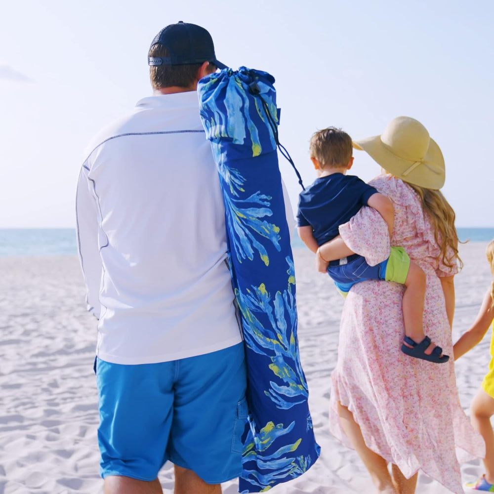 A family of three is walking to the beach with a portable cabana carry bag for AMMSUN 6.2'×6.2' coral tropical with sunwall