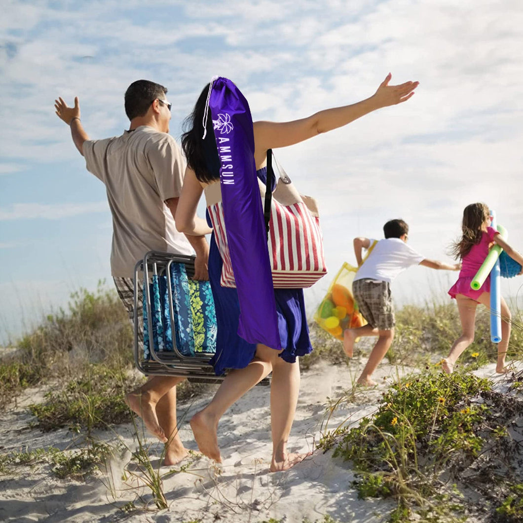 A family of four enjoying the beach, with AMMSUN 6.5ft purple portable beach umbrella with stand in bag