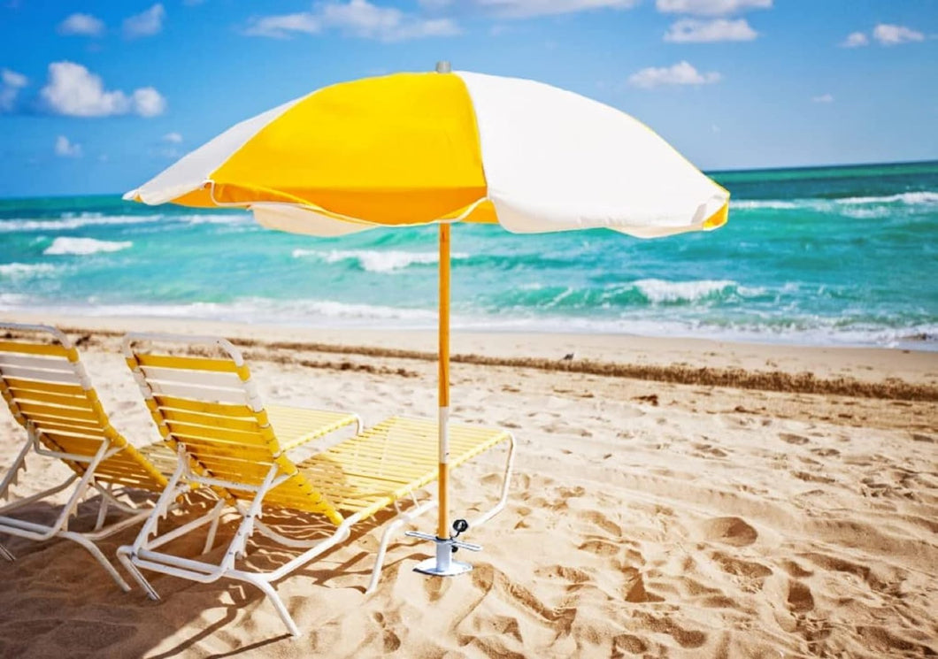 Two lounge chairs under an umbrella with AMMSUN white metal stand outdoor base on beach