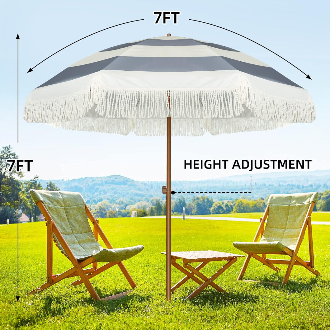 AMMSUN 7ft grey stripes picnic table umbrella with fringe with height adjustment is standing on the grass 