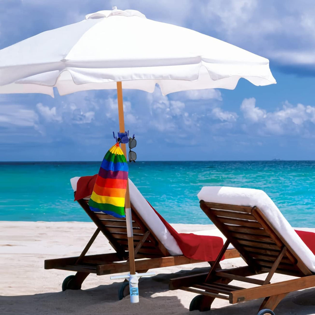 A calm sandy beach scene showcasing a white  umbrella with umbrella holder outdoor for sand umbrella