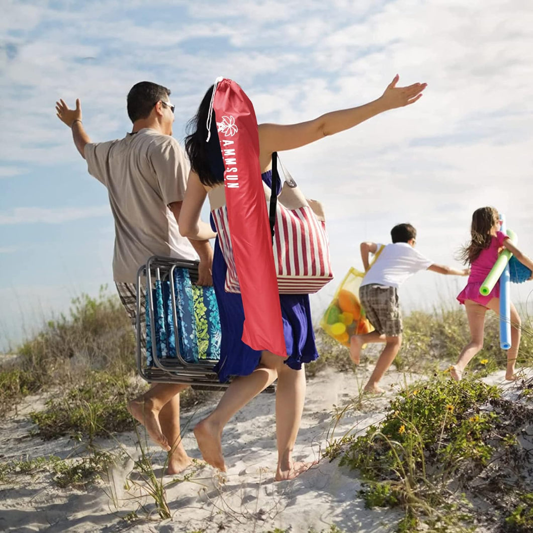 A family of four joyfully runs along the beach, pulling their AMMSUN 6.5ft pink sombrilla portable beach umbrella in the bag