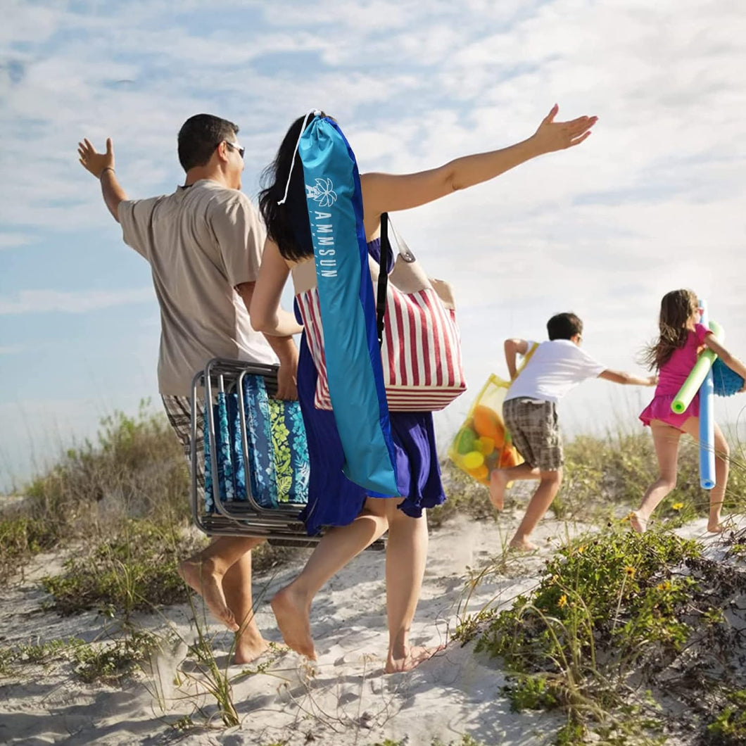 The family of four are walking happily to the beach, and the wife are carrying the AMMSUN 6.5ft lightweight umbrella in bag