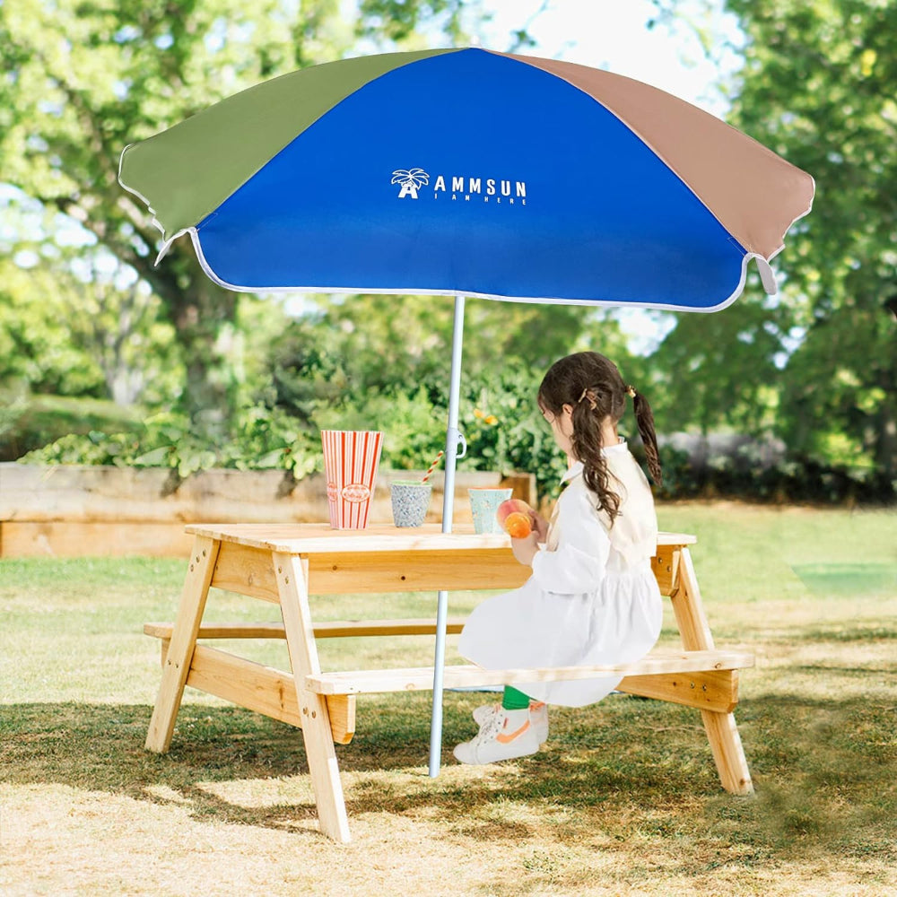 A girl sits at a picnic table, enjoying a pleasant day outdoors while sitting under AMMSUN 5ft Kid umbrella chair, Green Blue kids umbrella girls