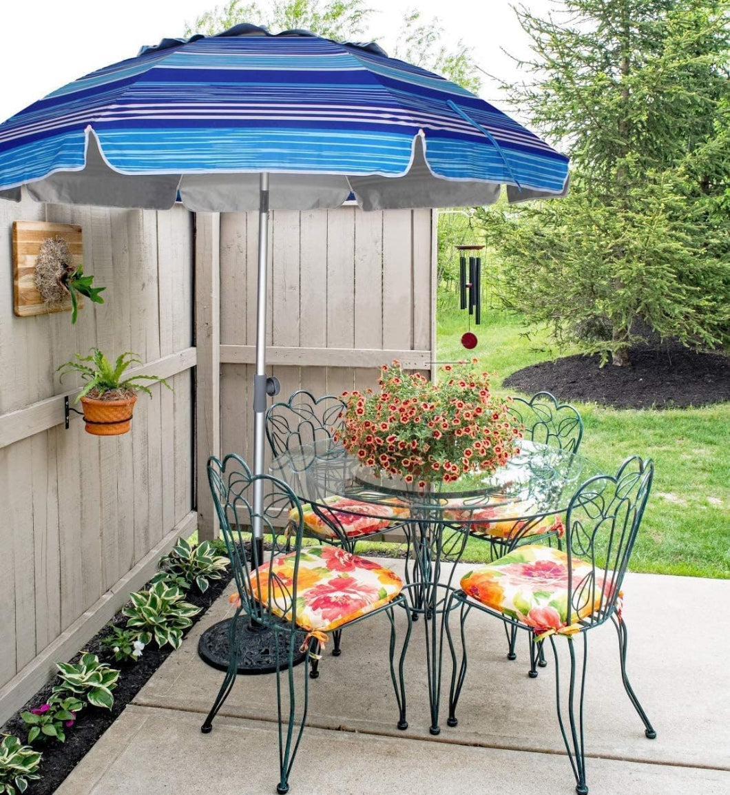 A patio table surrounded by chairs and AMMSUN 7ft multicolor light blue stripes umbrella for picnic table