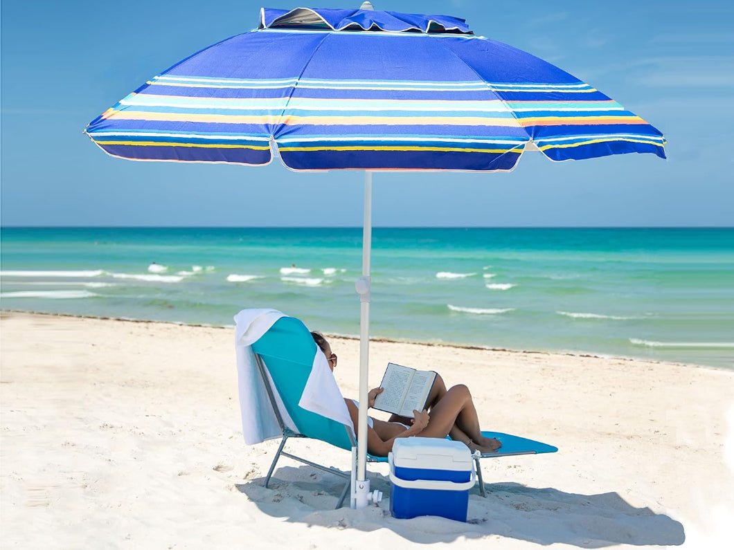 A woman raading a book beneath AMMSUN 7ft blue stripes beach umbrellas for sand with sand anchor