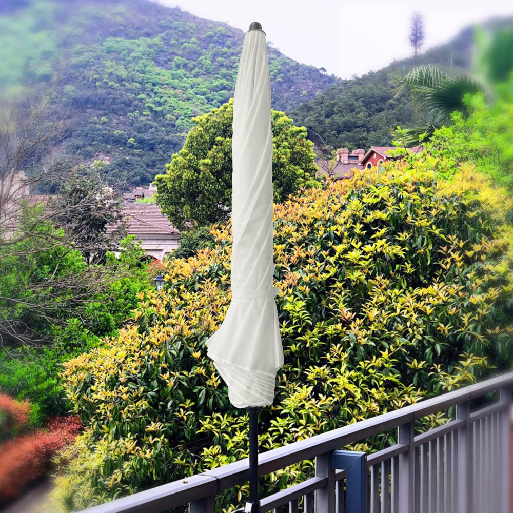 The lower pole of the AMMSUN 6.5ft white umbrella outdoor patio is fastened to a balcony railing