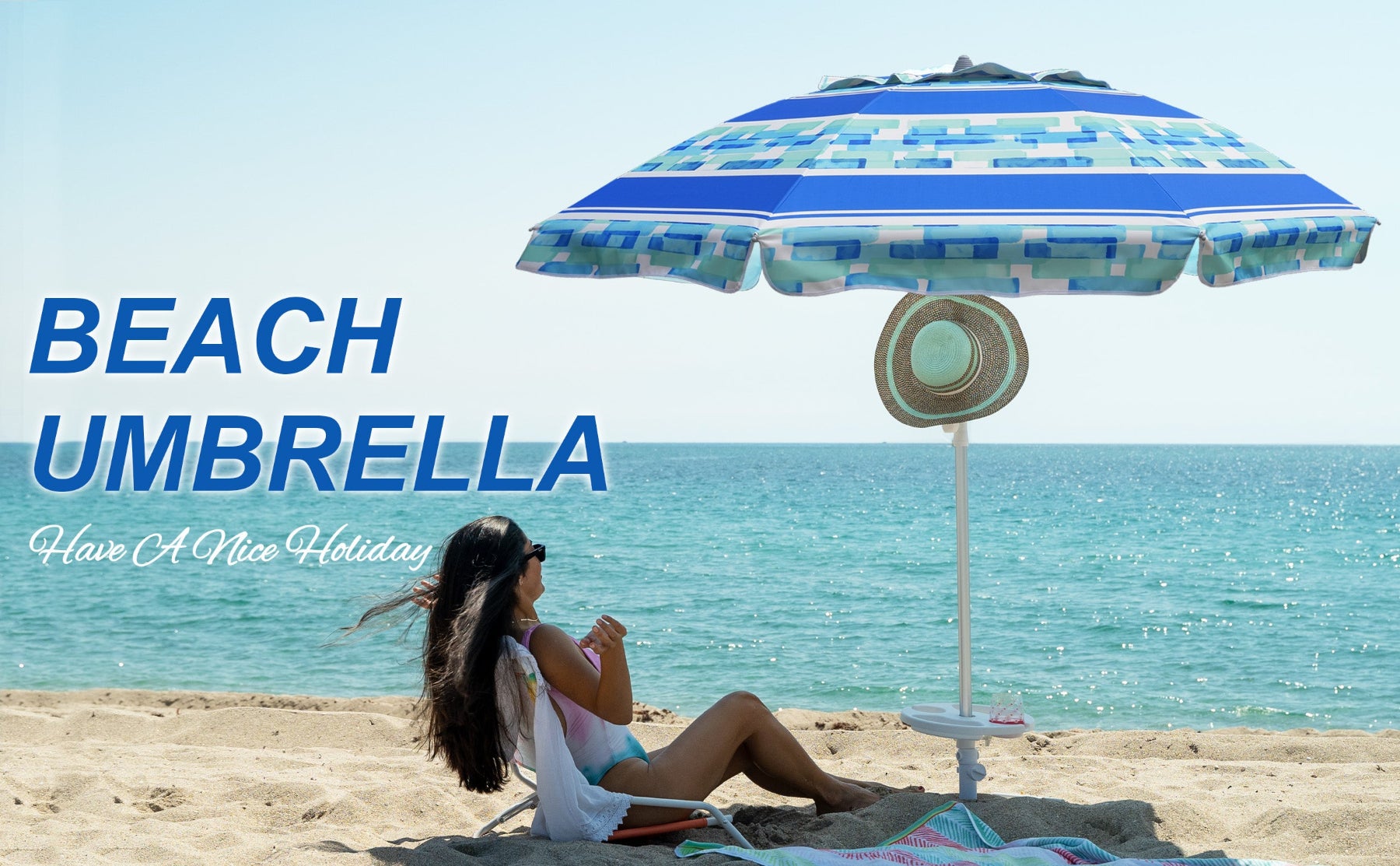 A woman sitting under AMMSUN 7ft ice blue stripes heavy duty umbrella with sand anchor, having the holiday